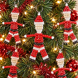 Make an easy beaded Christmas ornament using pony beads and a simple Santa pattern. Perfect for kid's Christmas crafts. Free Instructions.